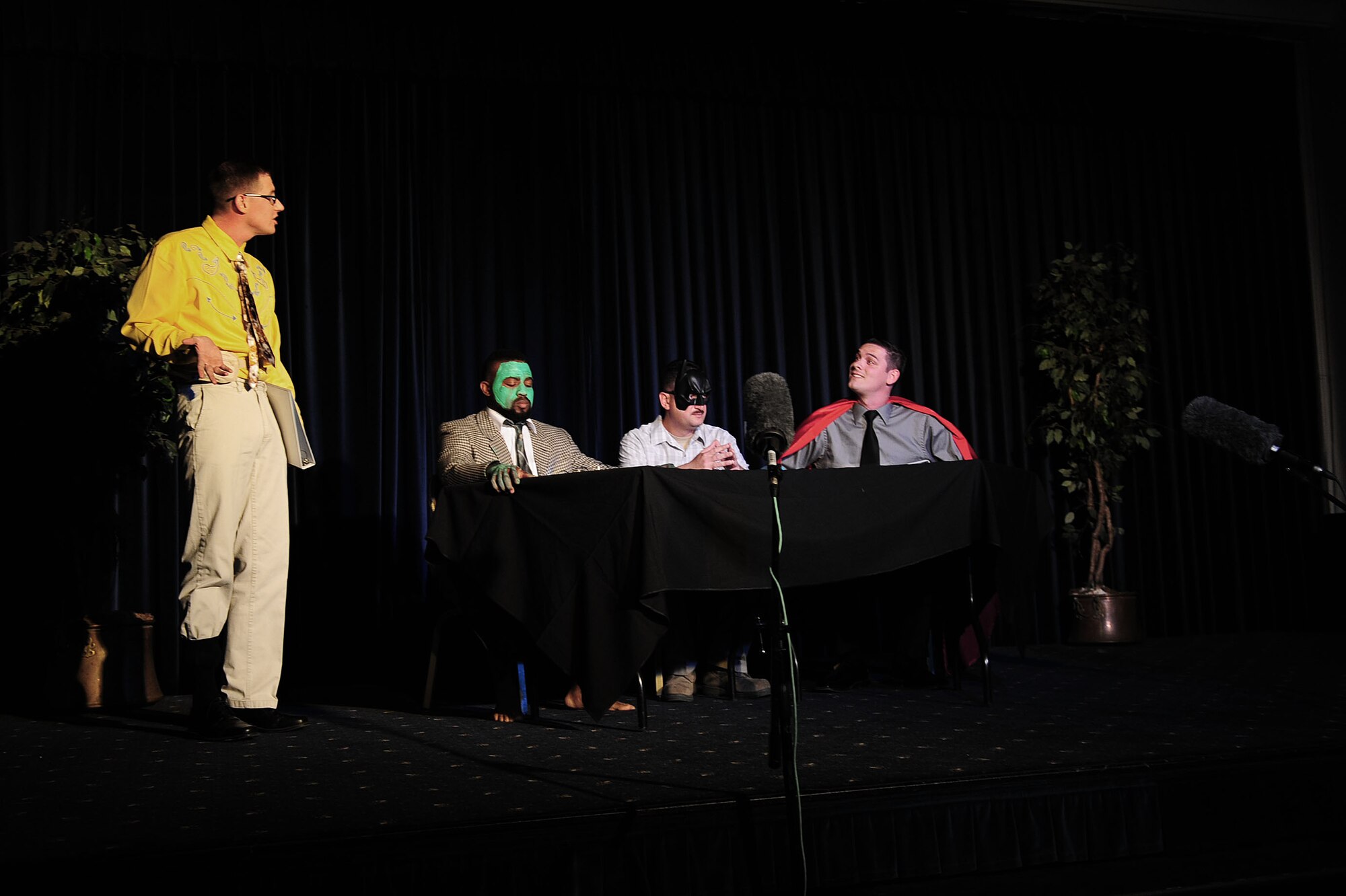 Actors dress up as superheroes for a comedy skit during the Saturday Night Live Incirlik 2 comedy show Nov. 2, 2013, at Incirlik Air Base, Turkey. All the actors were Airmen, family members or base personnel who volunteered their time off to make the event a success. (U.S. Air Force photo by Airman 1st Class Nicole Sikorski/Released)