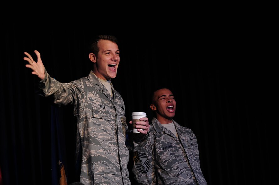 Airman 1st Class Stephen Jarman, American Forces Network-Incirlik broadcaster, and Airman 1st Class Dimetrius Anderson, 728th Air Mobility Squadron aircraft services apprentice, perform a town hall skit at the Saturday Night Live Incirlik 2 comedy show Nov. 2, 2013, at Incirlik Air Base, Turkey. SNLI 2 was a free event put on by a group on base called the Raconteurs. (U.S. Air Force photo by Airman 1st Class Nicole Sikorski/Released) 