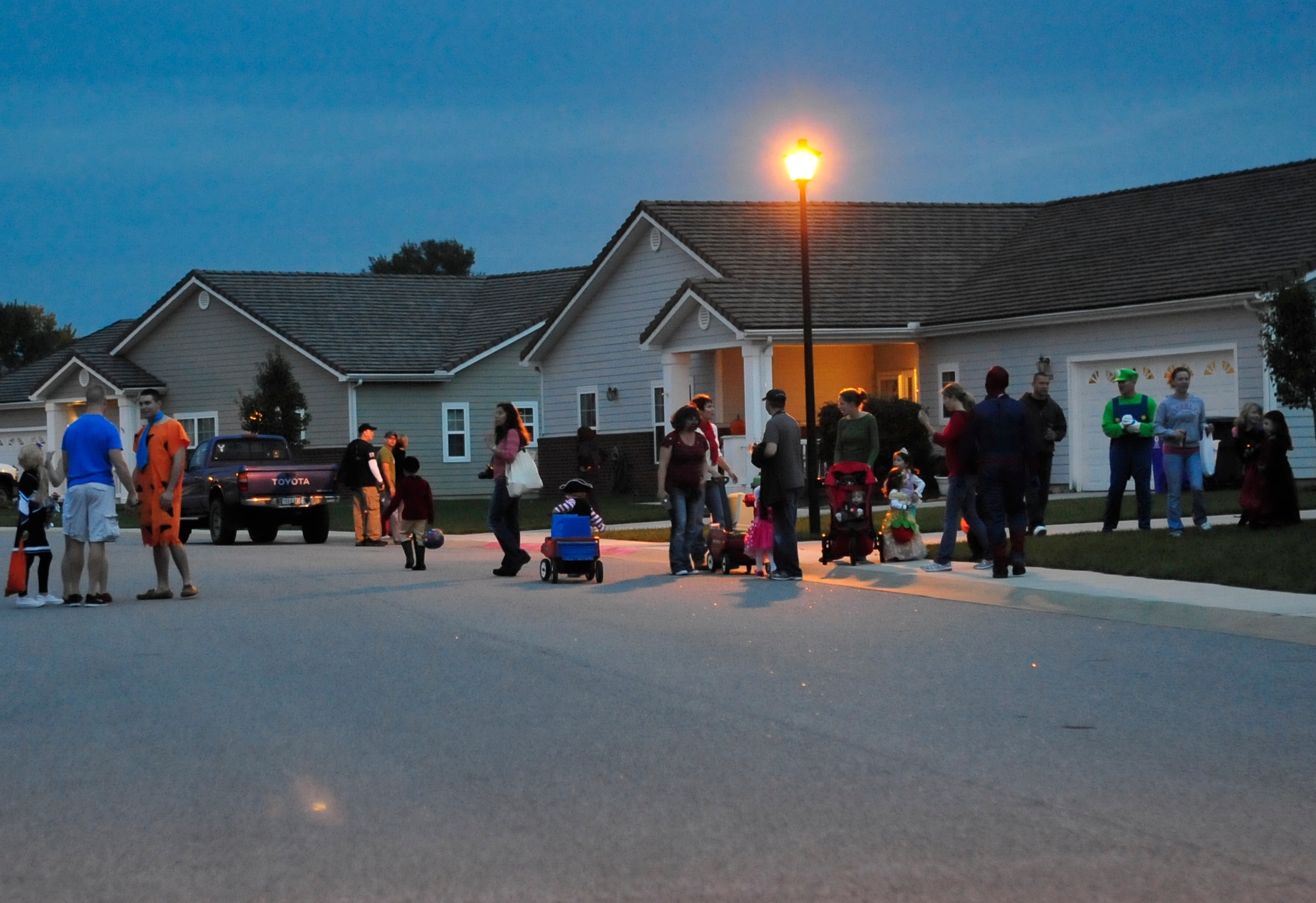 A view from base housing shows families trick-or-treating Oct. 31, 2013, at Dover Air Force Base, Del. Families dressed up in costumes and went trick-or-treating. (U.S. Air Force photo/Airman 1st Class William Johnson)