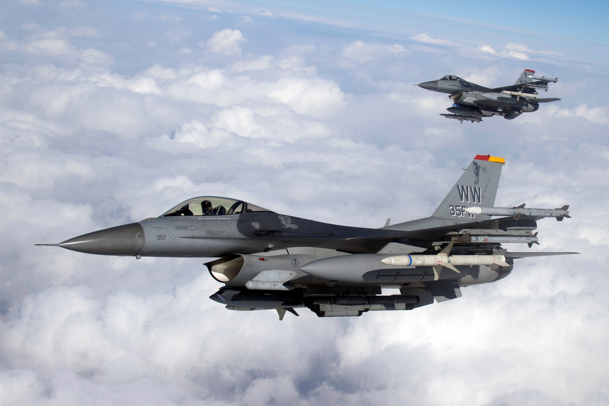 U.S. Air Force F-16 Fighting Falcons with the 35th Fighter Wing fly a training mission over Misawa Air Base, Japan, Feb. 14, 2013. The F-16 is the sixth generation aircraft of the Wild Weasels whose mission is the Suppression of Enemy Air Defenses, or SEAD. (Photo by Jake Melampy)