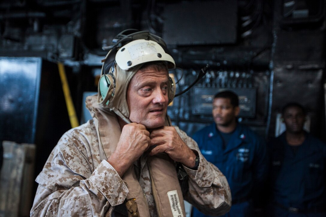 U.S. Marine Maj. Gen. Mark Clark, Marine Corps Forces Special Operations Command commanding general, prepares to depart the USS Bataan (LHD 5) off the East Coast Oct. 30, 2013. The 22nd Marine Expeditionary Unit (MEU) is currently taking part in the Amphibious Ready Group (ARG)/MEU Exercise in preparation for its scheduled 2014 deployment to the U.S. 5th and 6th Fleet areas of responsibility with the Bataan ARG as a sea-based, expeditionary crisis response force capable of conducting amphibious missions across the full range of military operations. (U.S. Marine Corps photo by Sgt. Austin Hazard/Released)