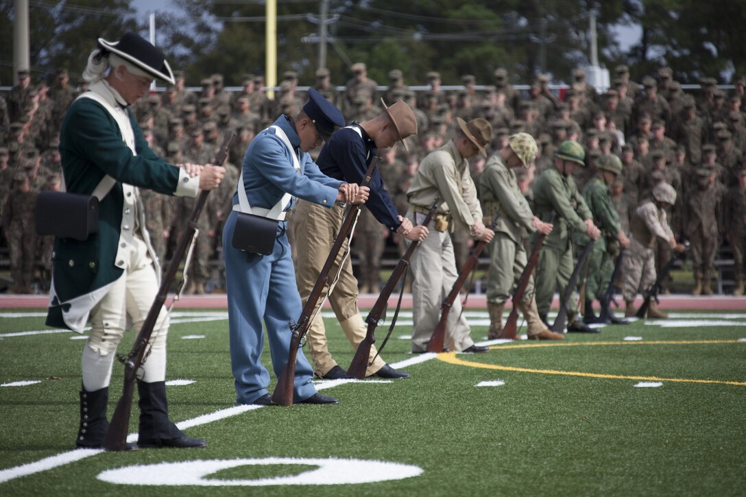 U.S. Marines that were part of the ceremonial pageant bow their heads during the Joint Daytime Ceremony aboard Camp Lejeune, N.C., Nov. 6, 2013. This part of the ceremony was in recognition of the Marines and Sailors that have given their lives in support of the United States. (U.S. Marine Corps photo by Lance Cpl. Andre Dakis, COMCAM, MCI-East, Camp Lejeune/Released)