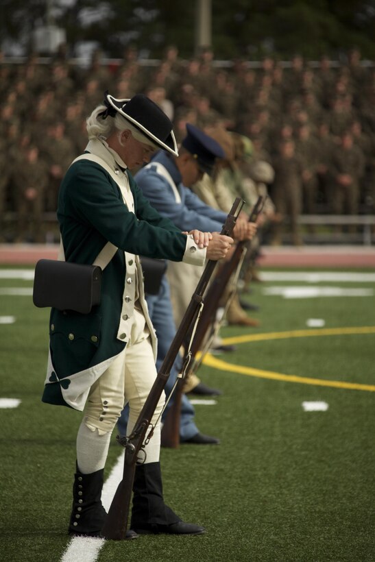 U.S. Marines that were part of the ceremonial pageant bow their heads during the chaplain's prayer during the Joint Daytime Ceremony aboard Camp Lejeune, N.C., Nov. 6, 2013. The traditional ceremony is held every year in honor of the Marine Corps birthday. (U.S. Marine Corps photo by Cpl. Adrian Weekly, Combat Camera, MCB Camp Lejeune/Released)