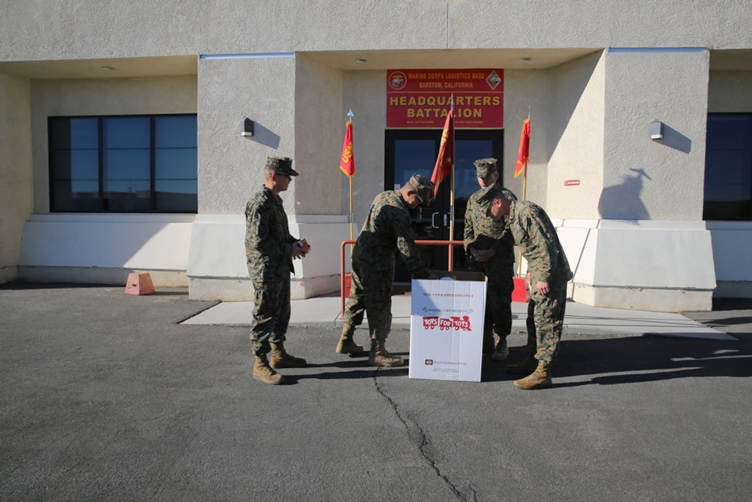 Marines with Headquarters Battalion on Marine Corps Logistics Base Barstow, Calif., prepare to raise the American flag for morning colors, Nov. 6. Colors is raised every morning at 8:00 a.m. and lowered at sundown. 