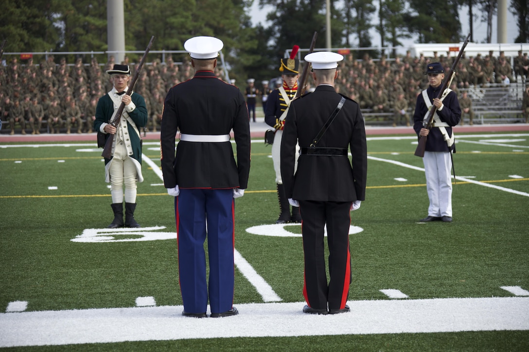 U.S. Marine Corps Sgt. Maj. Ernest K. Hoopii, Marine Corps Installations East (MCI-E) sergeant major (left), and Brig. Gen. Robert F. Castellvi, MCI-E commanding general (right), stand at attention during the Joint Daytime Ceremony aboard Camp Lejeune, N.C., Nov. 06, 2013. The traditional ceremony is held every year in honor of the Marine Corps birthday. (U.S. Marine Corps photo by Cpl. Adrian Weekly, Combat Camera, MCB Camp Lejeune/Released)