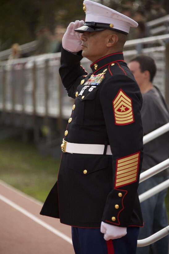 U.S. Marine Corps Sgt. Maj. Ernest K. Hoopii, Marine Corps Installations East sergeant major, salutes during the roll call of honor at the Joint Daytime Ceremony aboard Camp Lejeune, N.C., Nov. 6, 2013. The traditional ceremony is held every year in honor of the Marine Corps birthday. (U.S. Marine Corps photo by Cpl. Adrian Weekly, Combat Camera, MCB Camp Lejeune/Released)