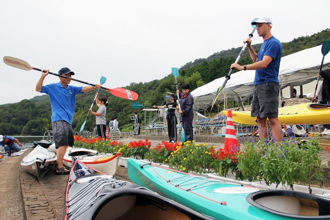 Local community kayakers practice rowing skills before getting into the water for a friendly kayak competition at Nakayama Lake in support of a national-level kayak competition Oct. 2. Three local Marines also participated in the friendly competition in support of the 66th National Sports Festival being hosted throughout Yamaguchi Prefecture Oct. 1 – 11. For several community members participating in the friendly kayak competition, it was their first time kayaking. The National Sports Festival is hosted every year in a different prefecture of Japan. This is the second time in 66 years Yamaguchi Prefecture has hosted the festival.
