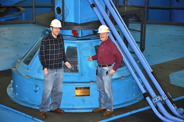 From left, Jamie Holt, power plant specialist, and Jamie James, project manager, stand atop U.S. Army Corps of Engineers Nashville District’s recently repaired Barkley Hydropower Plant Unit 1 generator Kuttawa, Ky. The unit suffered a phase-to-ground fault resulting in a fire that damaged the 32.5 Megawatt generator wirings in Dec. 19, 2010. The $11.5 million, major repair project began Aug. 15, 2012 when contractor employees lifted the 270-ton assembly by crane and placed it on a nearby pedestal for repair by National Electric Coil from Columbus, Ohio. Unit 1 was placed back on line Nov. 18, 2013.