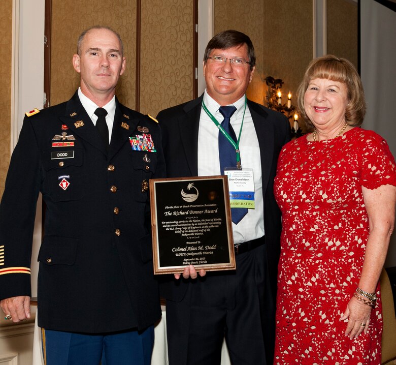 Col. Alan Dodd (left), district commander, received the 2013 Richard Bonner Award from Don Donaldson, sponsor for Palm Beach County and Debbie Flack, FSBPA president, during the FSBPA’s 57th Annual Conference at Delray Beach Sept. 25-27. 