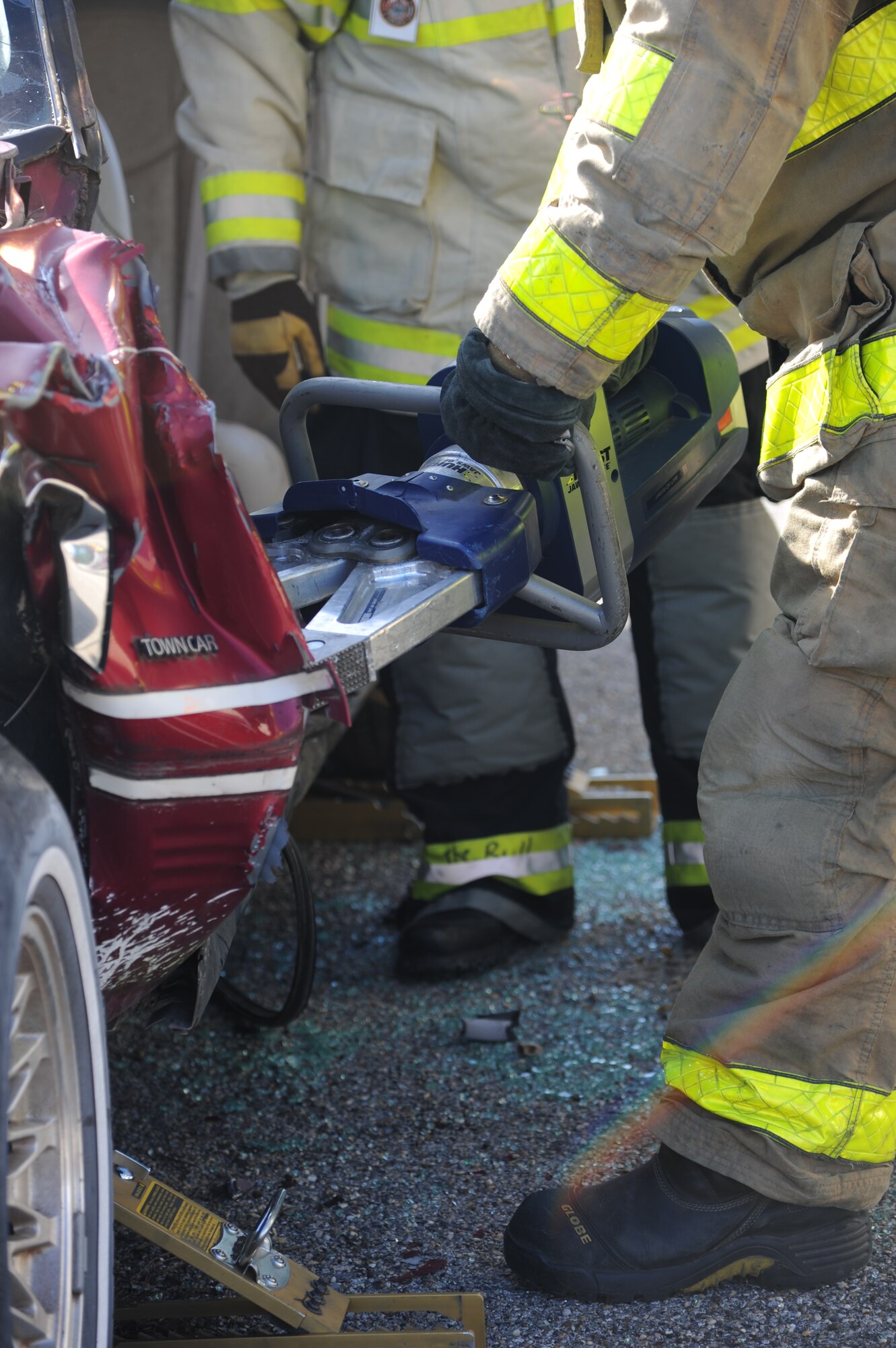 The new battery powered jaws of life cutters are used to remove vehicle metal to expose victims for removal during a two-day joint auto extrication training by Keesler and Biloxi firefighters Nov. 5, 2013, at Keesler Air Force Base, Miss. Keesler and Biloxi Fire Departments conduct several joint training sessions a year to include: live fire structural burn, auto and a variety of other classes.  (U.S. Air Force photo by Kemberly Groue)