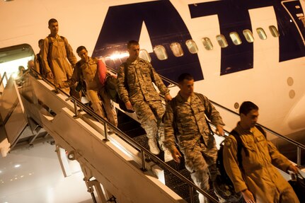 Airmen of the 437th Airlift Wing and 14th Airlift Squadron exit the aircraft that brought them home from deployment November 2, 2013 at Joint Base Charleston — Air Base, S.C. (U.S. Air Force photo/Airman 1st Class Michael Reeves)