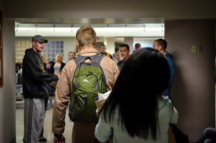 437th Airlift Wing and 14th Airlift Squadron Airmen who recently returned from deployment are greeted with smiles and handshakes as they exit the Passenger Terminal November 2, 2013 at Joint Base Charleston — Air Base, S.C. (U.S. Air Force photo/Airman 1st Class Michael Reeves)