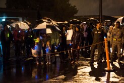 Friends and family of the deployed members of the 437th Airlift Wing and 14th Airlift Squadron brave the weather as they wait for their loved ones to exit the plane on November 2, 2013 at Joint Base Charleston — Air Base, S.C. (U.S. Air Force photo/Airman 1st Class Michael Reeves)