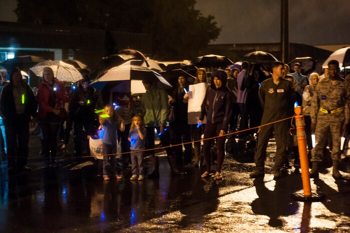 Friends and family of the deployed members of the 437th Airlift Wing and 14th Airlift Squadron brave the weather as they wait for their loved ones to exit the plane on November 2, 2013 at Joint Base Charleston — Air Base, S.C. (U.S. Air Force photo/Airman 1st Class Michael Reeves)
