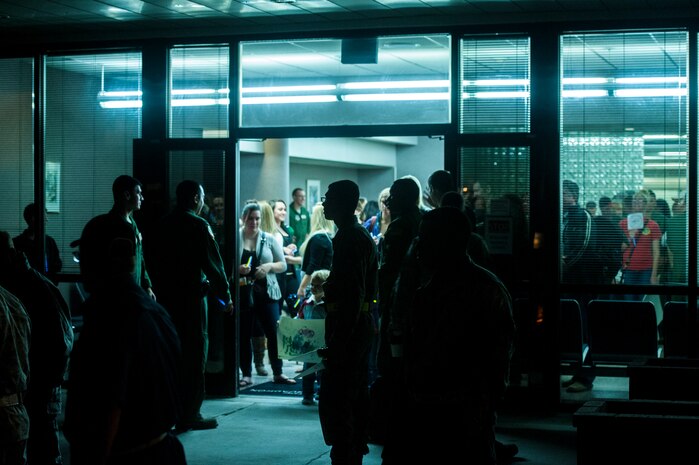 Friends and family of the deployed members of the 437th Airlift Wing and 14th Airlift Squadron wait with anticipation as Airmen began escorting them to the flight line at Joint Base Charleston — Air Base, S.C. on November 2, 2013. (U.S. Air Force photo/Airman 1st Class Michael Reeves)