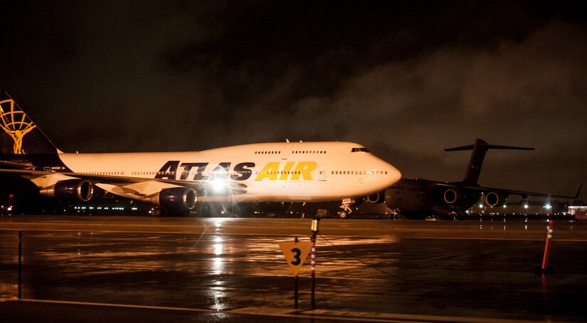 The aircraft carrying deployed members of 437th Airlift Wing and 14th Airlift Squadron taxis into position upon its return to Joint Base Charleston — Air Base, S.C. early in the morning on November 2, 2013. (U.S. Air Force photo/Airman 1st Class Michael Reeves)