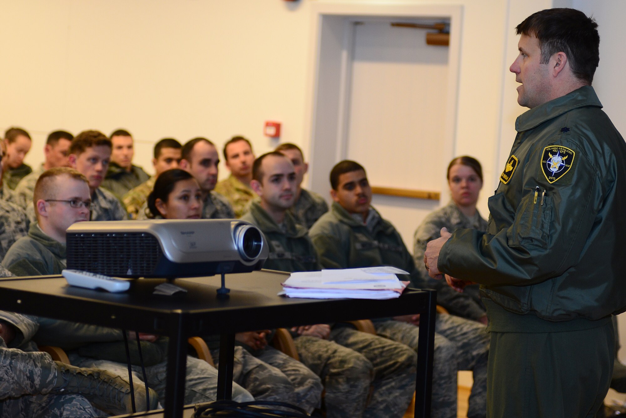 Lt. Col. Lendy Renegar, 48th Air Expeditionary Group commander, speaks to more than 200 Airmen at an all call at Keflavik International Airport, Iceland, Nov. 4, 2013. Airmen from Royal Air Force Lakenheath, RAF Mildenhall, Spangdahlem Air Base, Ramstein AB, Davis-Monthan Air Force Base, Tinker AFB and Robins AFB arrived at Keflavik International Airport, Iceland, Oct. 28, 2013, to complete an air surveillance exercise in support of a bilateral agreement between the U.S. and Iceland. (U.S. Air Force photo by Airman 1st Class Dana J. Butler)