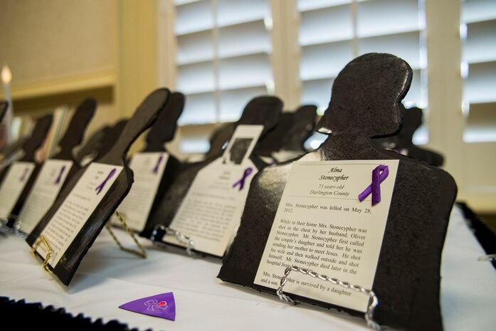 Black silhouettes sit in memory of victims who were lost due to domestic violence in South Carolina at a Domestic Violence Awareness luncheon October 31, 2013 at Joint Base Charleston, S.C. The luncheon featured guest speaker, Lucy Forest, whose daughter was a victim of domestic violence. (U.S. Air Force photo/Senior Airman Ashlee Galloway)