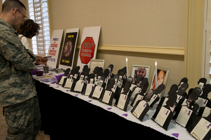 Col. Michael Mongold, 628th Mission Support group commander, attends a Domestic Violence Awareness luncheon October 31, 2013 at Joint Base Charleston, S.C. The luncheon featured guest speaker, Lucy Forest, whose daughter was a victim of domestic violence. (U.S. Air Force photo/Senior Airman Ashlee Galloway)