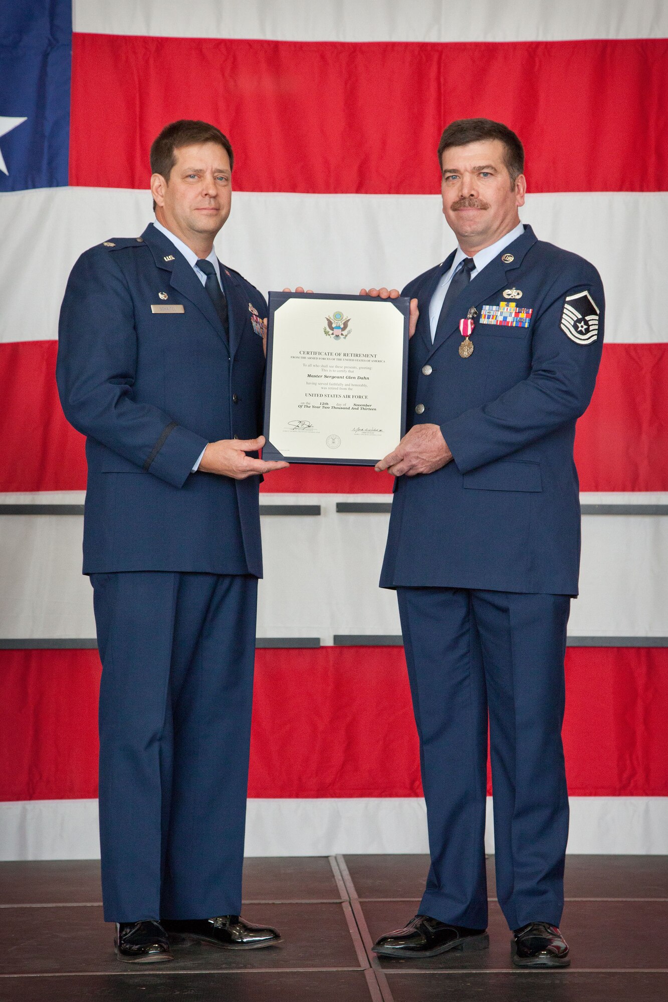 Lt. Col. Marvin Schaitel, 934th Maintenance Group deputy commander, presents Master Sgt. Glen Dahn with his Certificate of Retirement at a ceremony Saturday, Nov. 2.  MSgt. Dahn retires after 28 years of service from the 934th Airlift Wing at the Minneapolis-St. Paul Air Reserve Station, Minn.  (U.S. Air Force photo/Shannon McKay)