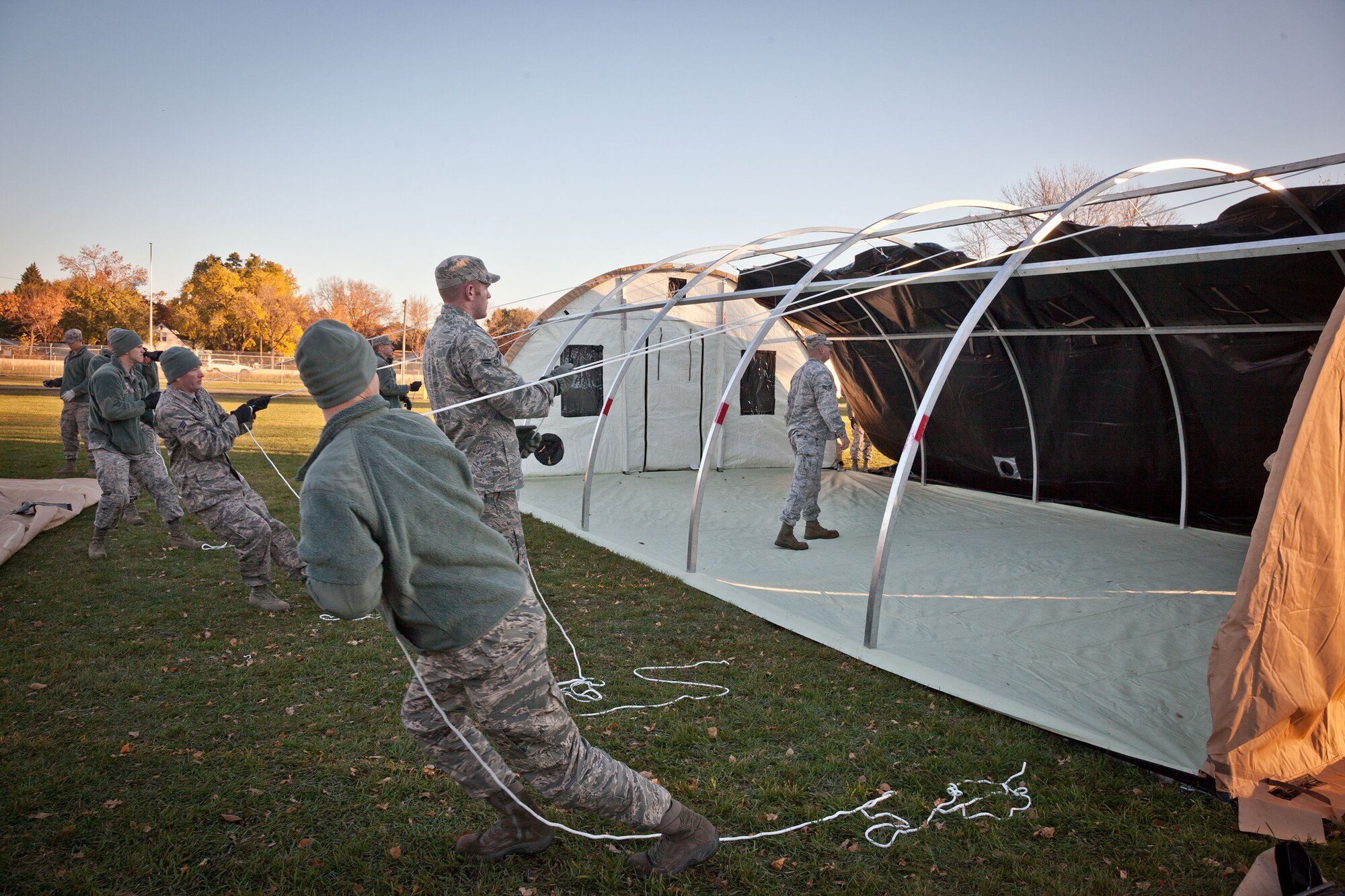 Members of the 934th Civil Engineering and Force Support Squadrons practice setting up and tearing down Alaska shelters during the November Unit Training Assembly weekend at the Minneapolis-St. Paul Air Reserve Station, Minn.  (U.S. Air Force photo/Shannon McKay)