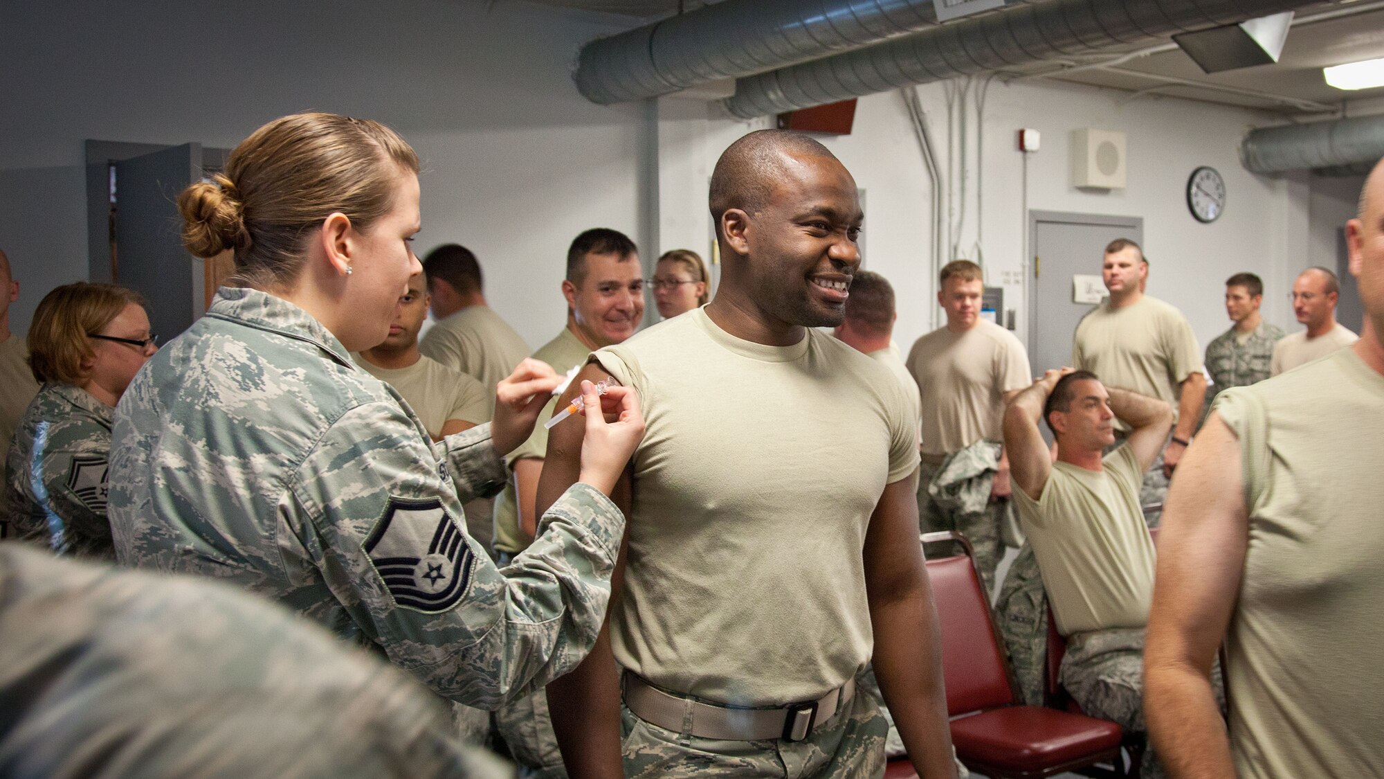 Members of the 934th Airlift Wing line up to receive their annual flu shot.  The 934th Aeromedical Staging Squadron held multiple mobile clinics over the Unit Training Assembly weekend to ensure all eligible Airmen were vaccinated.  (U.S. Air Force photo/Shannon McKay)