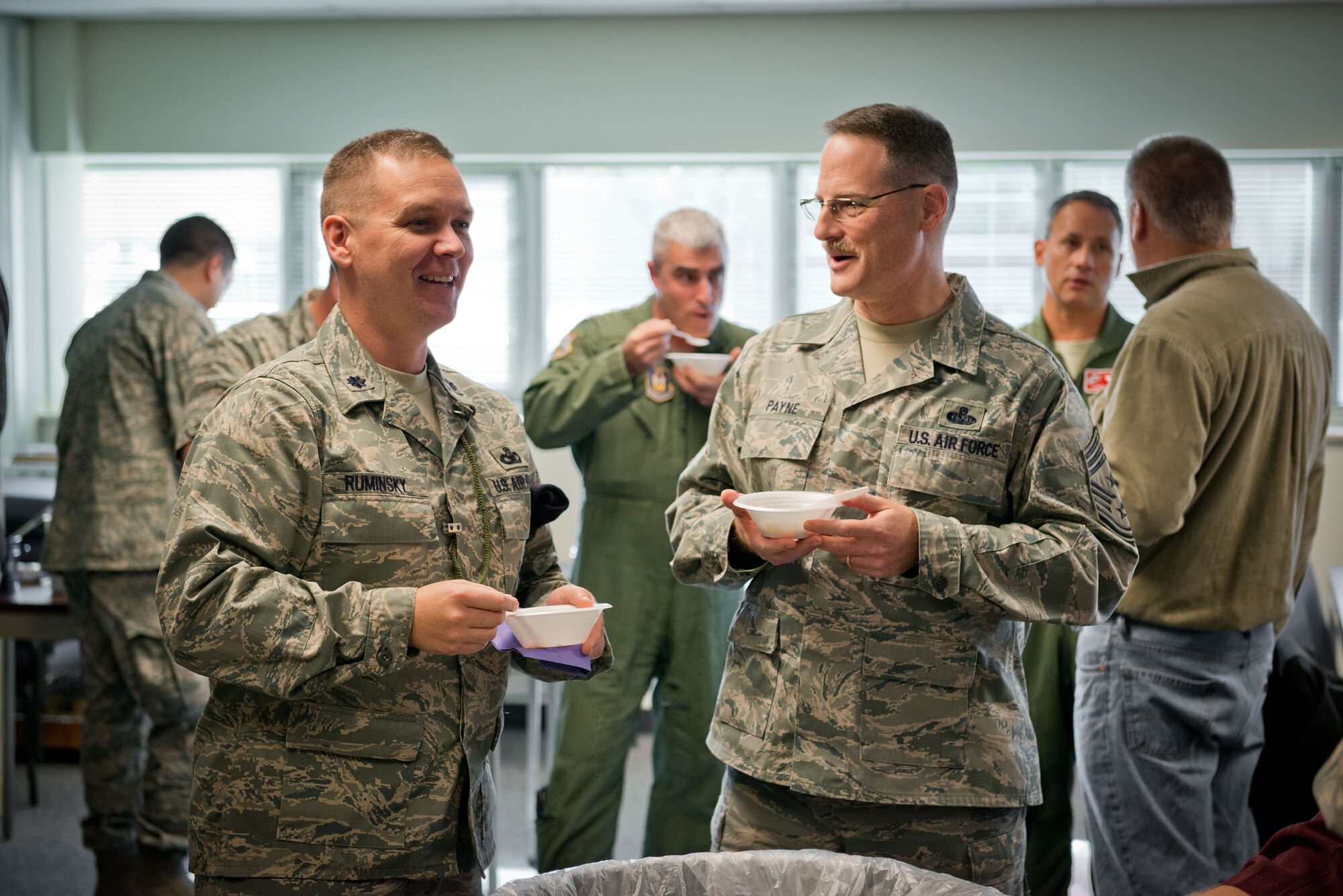 Lt. Col. Ted Ruminsky, 934th Security Forces commander, and Chief Master Sgt. Bryan Payne, 934th Airlift Wing command chief, sample some chili at a cook off contest hosted by the wing to benefit the Combined Federal Campaign fund Friday.  The event raised $200 for registered charities within the program.  (U.S. Air Force photo/Keith Langsdorf)