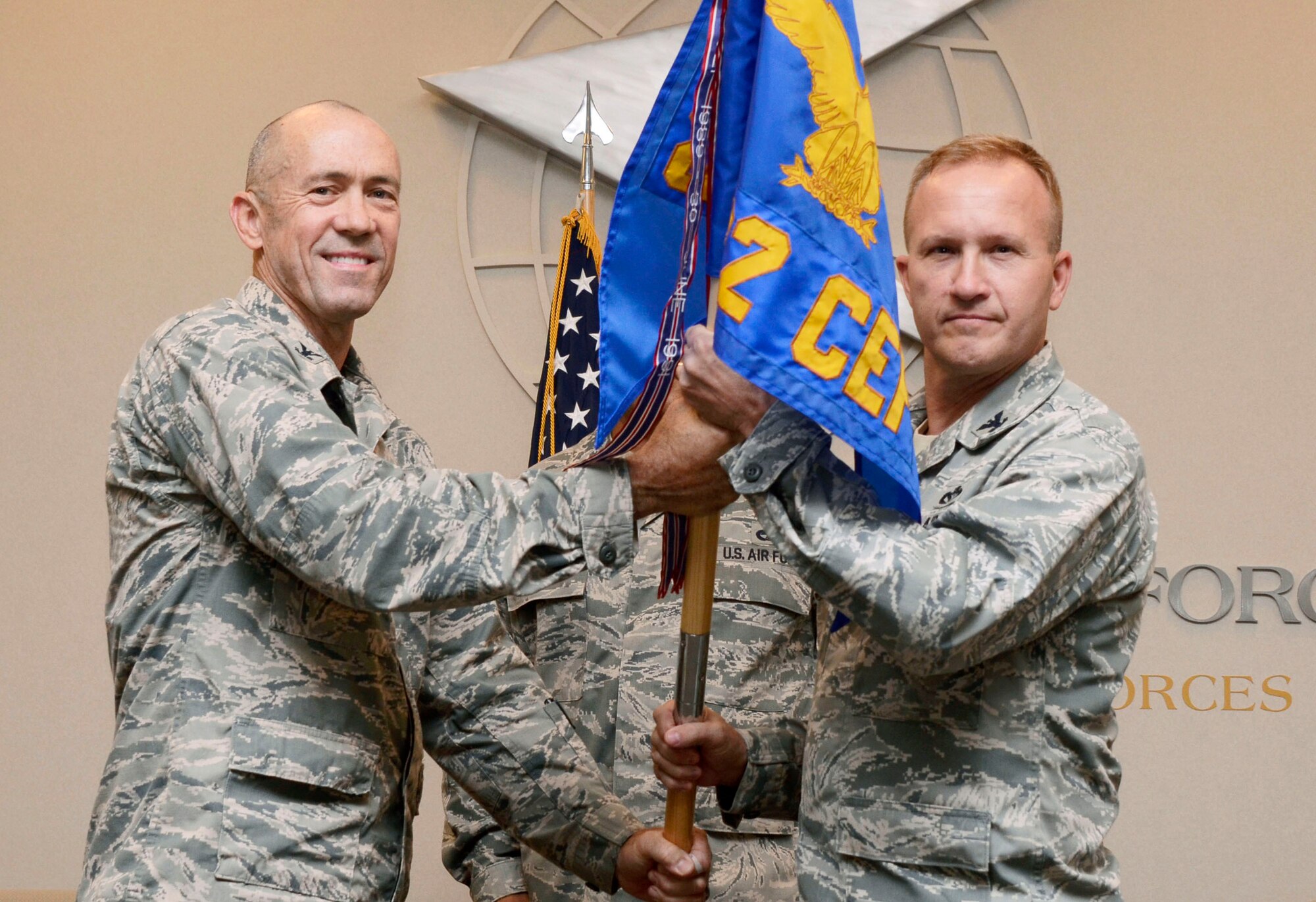 Col. James E. Lehman receives the unit flag from Col. Timothy W. Lamb, 622nd Civil Engineer Group commander, taking command of the 622nd Civil Engineer Flight at an Assumption of Command ceremony at Dobbins Air Reserve Base, Ga., Nov. 1. Lehman will be responsible for providing command staff augmentation for engineer management, technical design, construction management, command and control in support of regional contingencies or natural disasters during wartime or stability operations.  (U.S. Air Force photo/Don Peek)