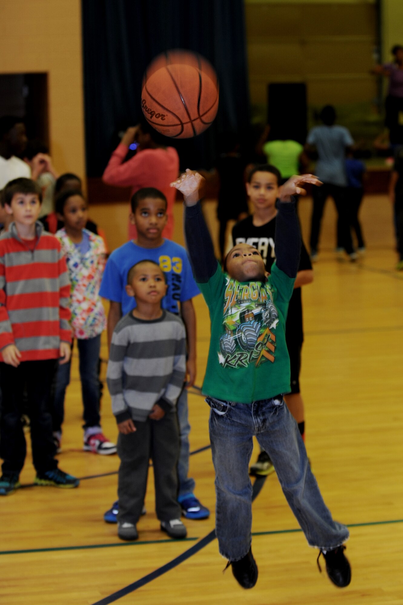 A Joint Base Langley-Eustis child plays basketball during the Joint Base Langley-Eustis Youth Program’s Triple Play event at the Bethel Manor Youth Center in Yorktown, Va., Nov. 5, 2013. The basketball portion covered Triple Play’s “body” aspect, which focuses on boosting physical activities of participants through fitness programs, activities and sports competitions. (U.S. Air Force photo by Staff Sgt. Jarad A. Denton/Released)