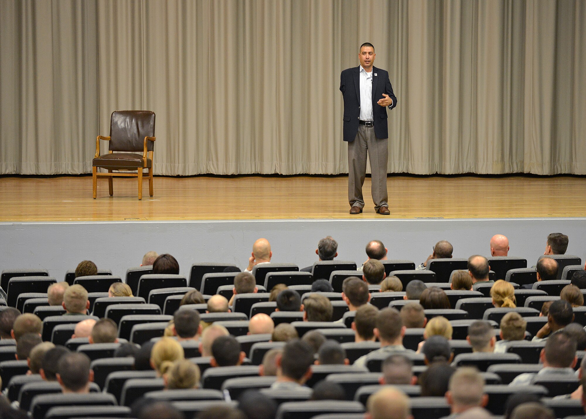 Norberto "Norbie" Lara speaks about resiliency and life challenges to a packed house at the Base Theater as part of Team Edwards' Wingman Day activities on Nov. 4. Lara is a wounded warrior who takes his inspiring story around the country as a spokesman for Warriors Speak, a Wounded Warrior Project program. (U.S. Air Force photo by Jet Fabara)