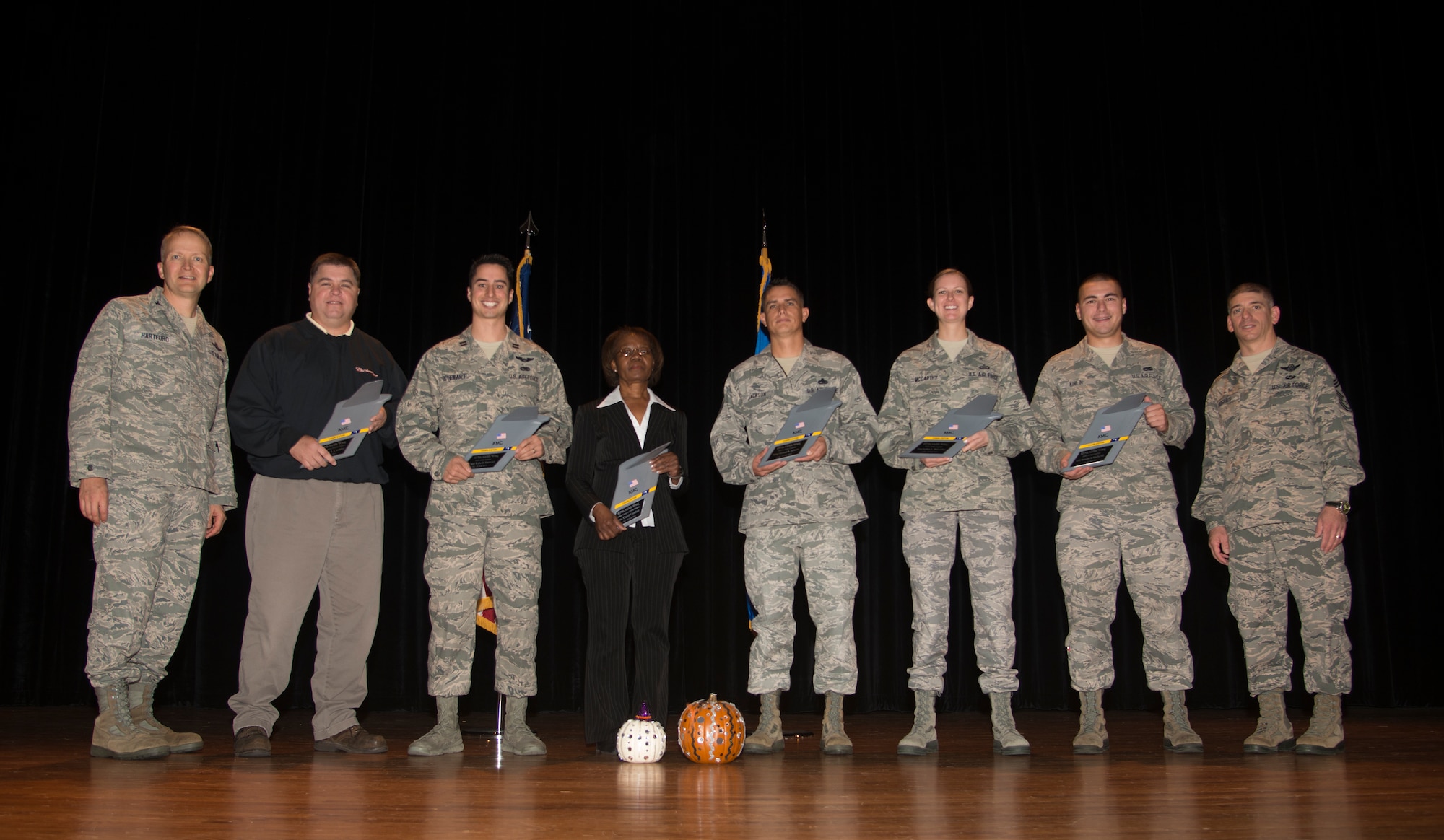 (Left)Col. Darren Hartford, 437th Airlift Wing commander, and (Right) Chief Master Sgt. Shawn Hughes, 437th AW command chief, stand with the 437th AW 4th Quarter Award Winners during the 3rd Quarterly Awards ceremony Oct 31, 2013, at Joint Base Charleston – Air Base, S.C. (Left to Right), Arthur Cormier, Civilian of the Quarter Category II, Capt. Kyle Stewart, Company Grade Officer of the Quarter, Carol Coulter, Civilian of the Quarter Category I, Master Sgt. Michael Jackson, Senior Noncommissioned Officer of the Quarter, Staff Sgt. Keitha McCarthy, Noncommissioned Officer of the Quarter, and Airman 1st Class Donald Kinlin, III. (U.S. Air Force photo/ Tech. Sgt. Rasheen Douglas)