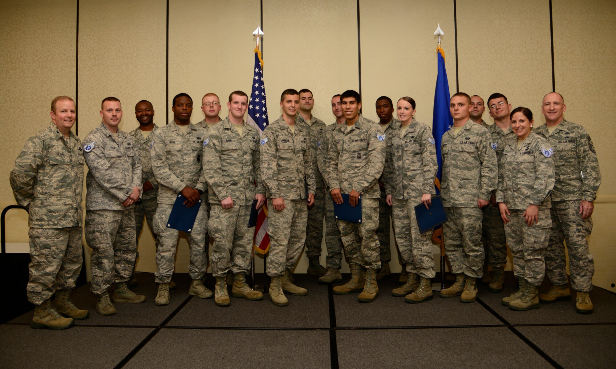 Members of Joint Base Charleston gather for a group photo with Col. Jeffrey DeVore, JB Charleston commander, and Chief Master Sgt. Al Hannon, 628th Air Base Wing command chief, after a promotion and Quarterly Awards ceremony for the 3rd Quarter on Oct. 31, 2013, at the Charleston Club on JB Charleston – Air Base, S.C. Twenty-four members of JB Charleston were recently promoted. (U.S. Air Force photo/Staff Sgt. Rasheen Douglas)