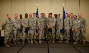Members of Joint Base Charleston gather for a group photo with Col. Jeffrey DeVore, JB Charleston commander, and Chief Master Sgt. Al Hannon, 628th Air Base Wing command chief, after a promotion and Quarterly Awards ceremony for the 3rd Quarter on Oct. 31, 2013, at the Charleston Club on JB Charleston – Air Base, S.C. Twenty-four members of JB Charleston were recently promoted. (U.S. Air Force photo/Staff Sgt. Rasheen Douglas)