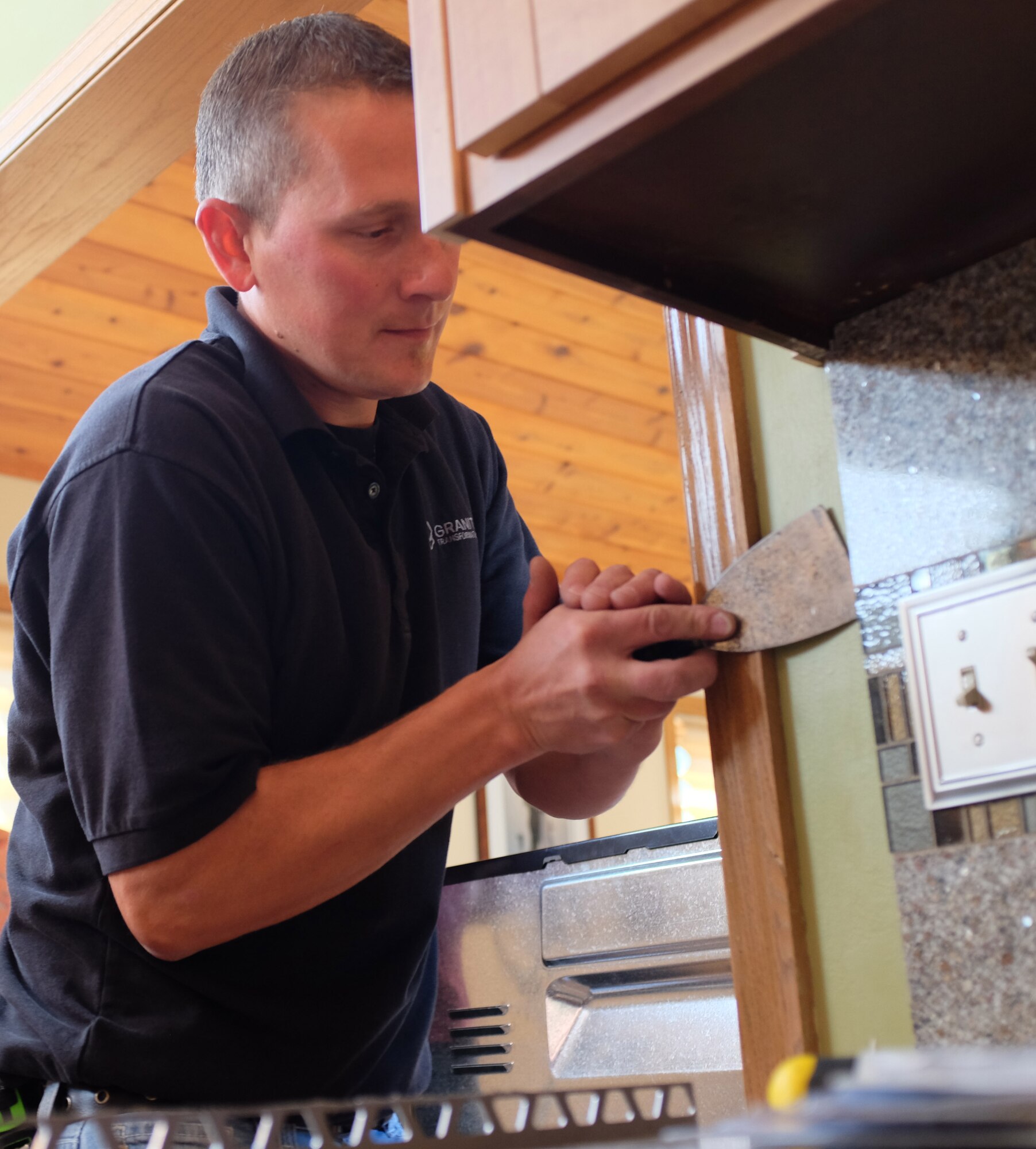 Staff Sgt. Naomi Bouska, 934th Force Support Squadron, has her kitchen transformed at no charge in a show of support for military members by a privately-owned company.  The transformation will Air on WCCO TV in Minneapolis at 5:30 a.m. Nov. 9.  (Air Force Photo/Paul Zadach)