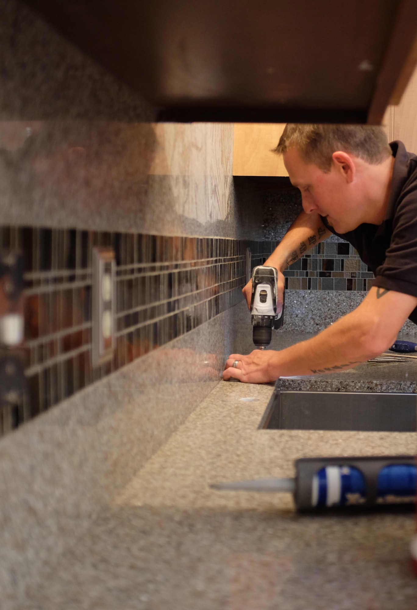 Staff Sgt. Naomi Bouska, 934th Force Support Squadron, has her kitchen transformed at no charge in a show of support for military members by a privately-owned company.  The transformation will Air on WCCO TV in Minneapolis at 5:30 a.m. Nov. 9.  (Air Force Photo/Paul Zadach)