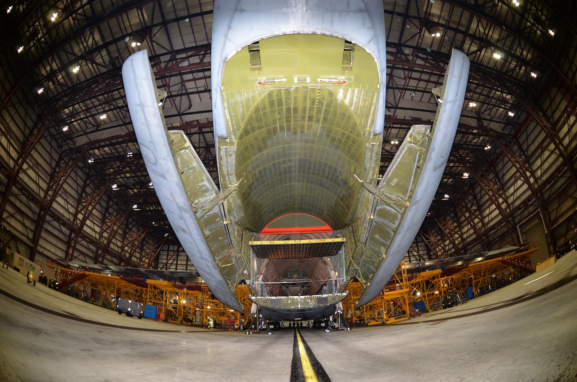 A C-5C Space Cargo Modified (SCM) Galaxy sits in Westover's Regional Isochronal Dock for maintenance, Nov. 3, 2013. The SCM Galaxy, specially modified to carry satellites and other large cargo, is the only modified version of the C-5 that provides special airlift support for satellites. With the troop compartment removed and modification to their aft loading doors, the C-5C aircraft have a larger cargo area than other C-5s. There are only two C-5C models in the entire C-5 fleet, both assigned to the 60th Air Mobility Wing in Travis AFB, Cali. (U.S. Air Force photo/SSgt. Kelly Goonan)