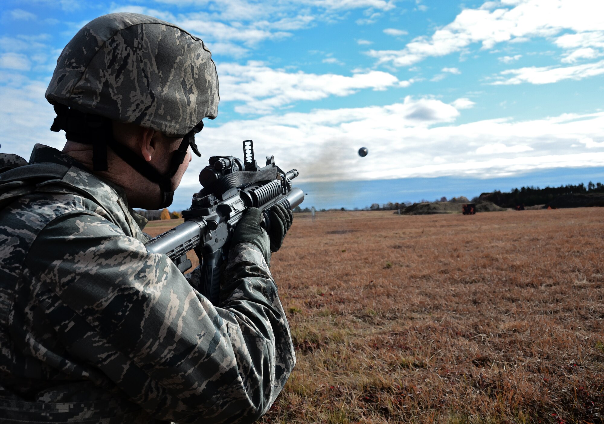 Capt. Charles Trovarello, 439th Security Forces Squadron, fires an M203 during weapons training Nov. 3, 2013, at Westover Air Reserve Base, Mass. The M203 is a single-shot 40mm grenade launcher designed to attach to a rifle and uses the same rounds as the older, stand-alone, M79 break-action grenade launcher, which utilizes the High-Low Propulsion System to keep recoil forces low. Security Forces conducts annual M203 training to keep Airmen qualified. (U.S. Air Force photo/SSgt. Kelly Goonan)