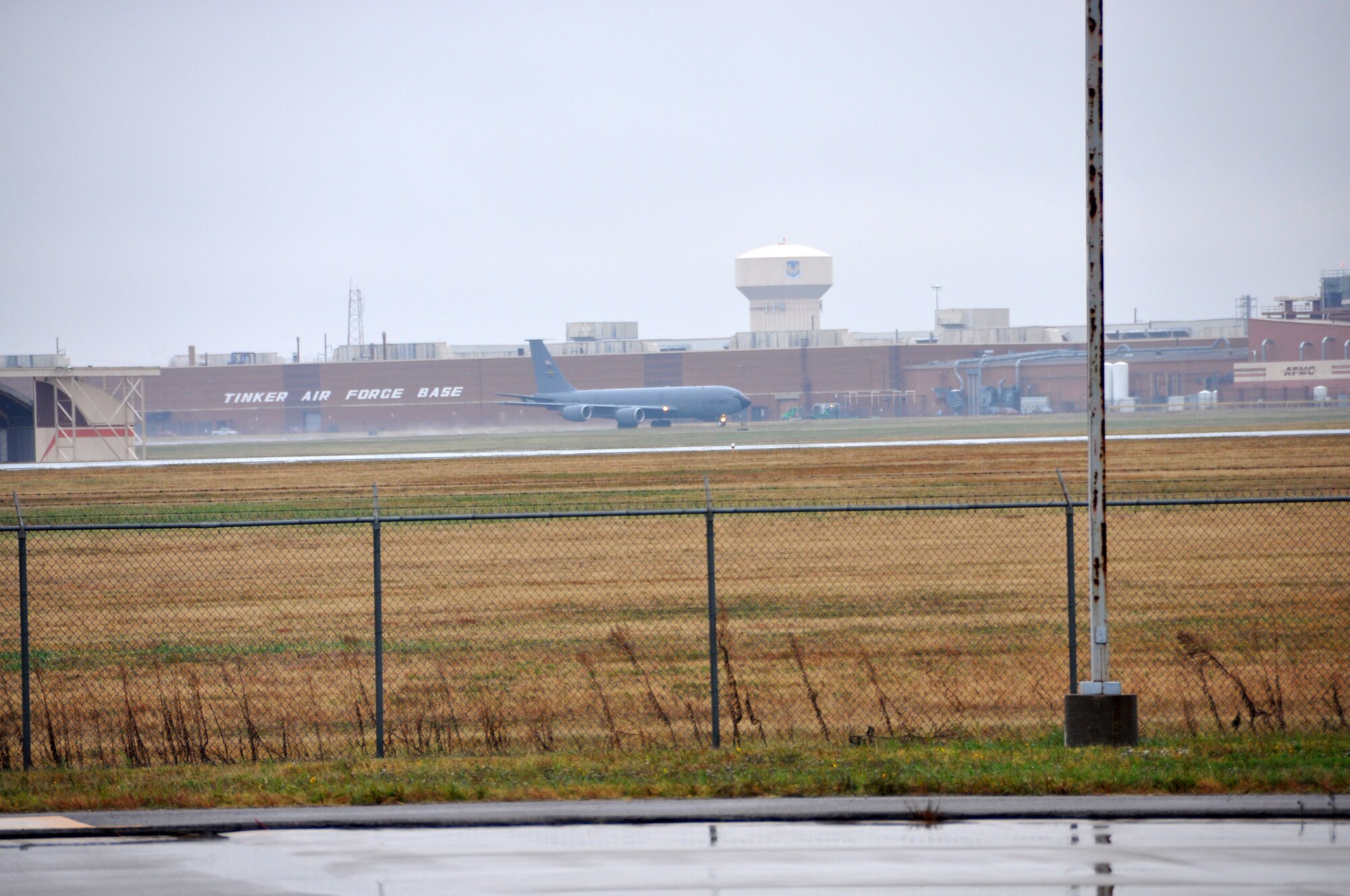 A 507th KC-135 Stratotanker departs in the rain.  The tanker is on its way to conduct aerial refueling operations in support of an ongoing exercise.  Pilots and boom operators from the 465th Air Refueling Squadron as well as maintenance personnel from the 507th Air Refueling Wing from Tinker Air Force Base Okla. have been launching and recovering aircraft for several days in support of the joint service exercise.  (U.S. Air Force photo/Senior Airman Mark Hybers)