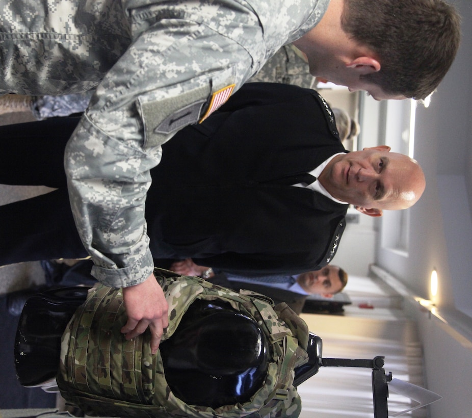 U.S. Army Capt. Brice A. Cooper briefs the Female Improved Outer Tactical Vest to Gen. Ray Odierno, chief of staff of the Army at Fort Belvoir, Va., Nov. 1, 2013. Odierno visited Program Executive Office Soldier to see the future of Army equipment. (PEO Soldier courtesy photo)