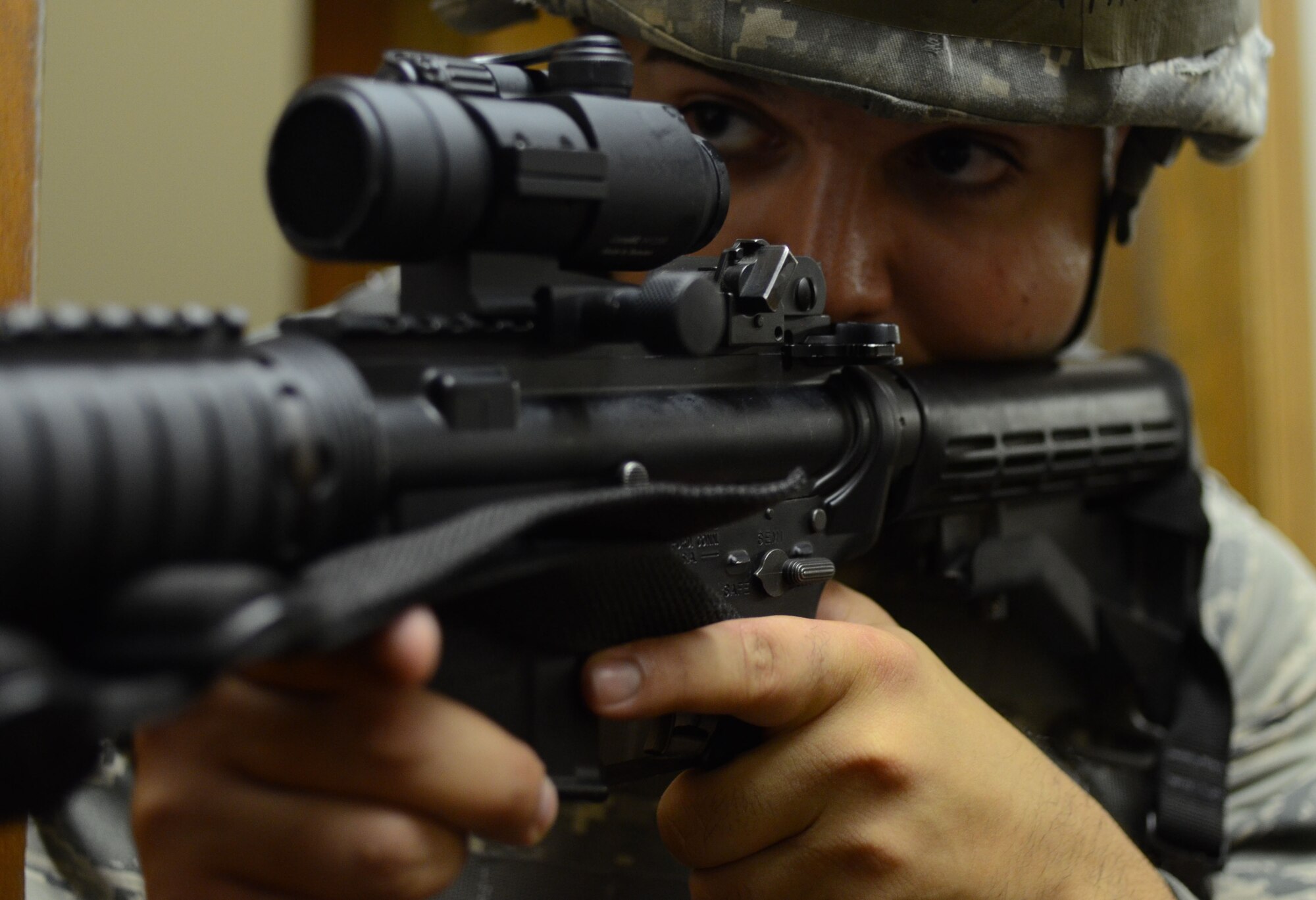 PATRICK AIR FORCE BASE, Fla. -- Senior Airman Michael Santana, 920th Security Forces Squadron, clears corners during urban warfare training at Patrick Air Force Base, Fla., Aug. 4, 2013. Security Forces Airmen train in for a variety of scenarios in a variety of environments to prepare for missions in almost any setting. (U.S. Air Force photo/Senior Airman Natasha Dowridge)