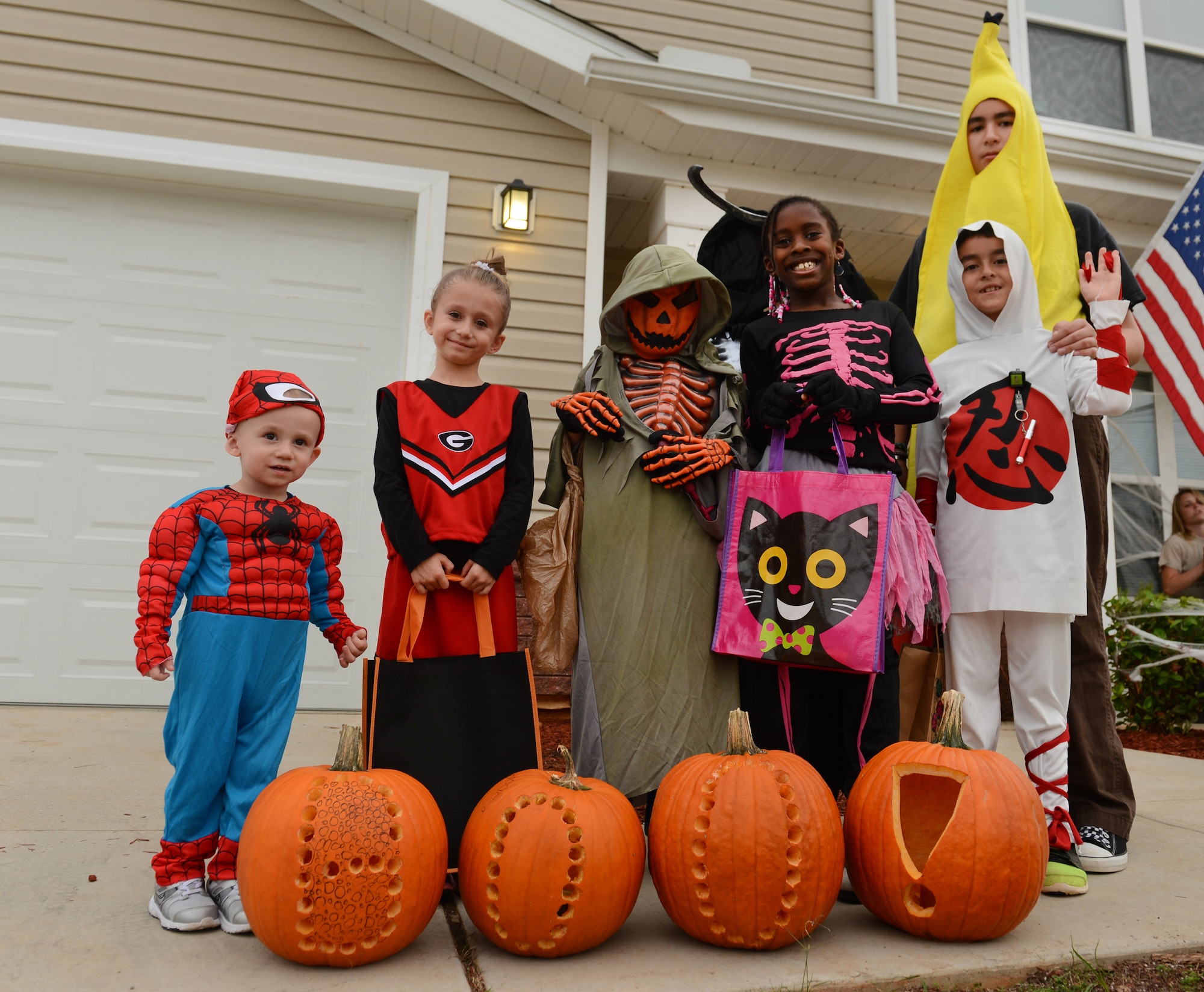 A group of children begin trick-or-treating, Shaw Air Force Base, S.C., Oct. 31, 2013. On Halloween night, Team Shaw dependents donned scary, cute and traditional costumes for trick-or-treating around base housing. (U.S. Air Force photo by Senior Airman Tabatha Zarrella/Released)
