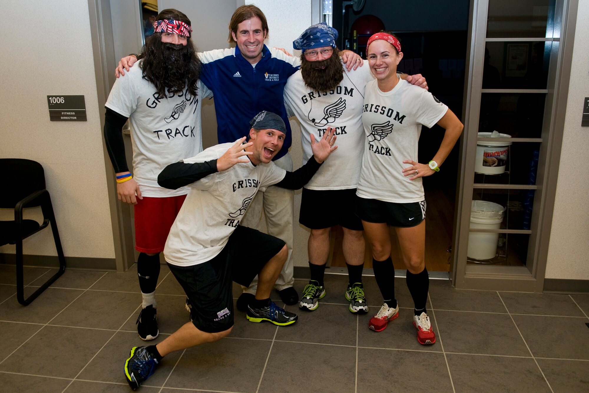 Zach Holmes, 434th Force Support Squadron fitness instructor, in blue, poses with runners of a 'Grissom Ghouls 5K' run who dressed like him for the race at Grissom Air Reserve Base, Ind., Oct. 31,2013. Costumed 'Zacs' from left to right are Kenneth W. Pinaire Jr., 434th Air Refueling Wing military pay chief; Cory Walters, 434th Civil Engineer Squadron biological scientist; Douglas Hays, 434th ARW public affairs superintendent; and Kasey Potts, 434th FSS fitness instructor. (U.S. Air Force photo/Tech. Sgt. Mark R. W. Orders-Woempner) 
