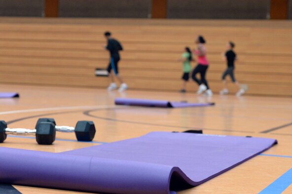 SPANGDAHLEM AIR BASE, GERMANY—Participants run laps in a MaxFit class at the Skelton Memorial Fitness Center Nov. 4, 2013. MaxFit is held every Monday and Wednesday at 5 p.m. and is open to members with base access at no cost. (U.S. Air Force photo by Senior Airman Alexis Siekert/Released)