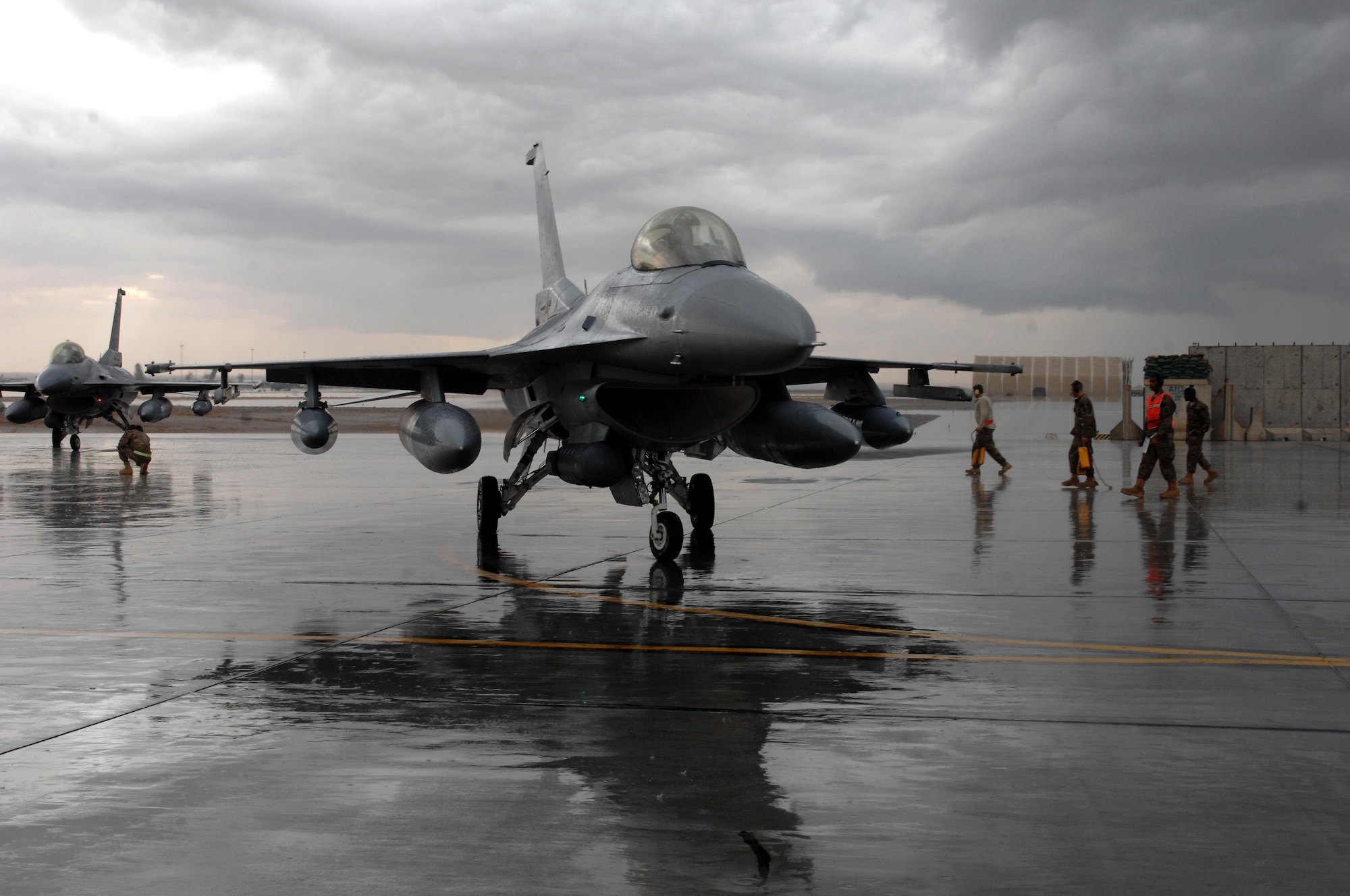 F-16 Fighting Falcons arrive at Kandahar Airfield, Afghanistan, from the 457th Fighter Squadron, Carswell, Texas, Nov. 5, 2013. The aircraft arrived as part of the changeover between the 457th FS and the 138th Fighter Squadron, Tulsa, Okla. (U.S. Air Force photo by Senior Airman Jack Sanders)