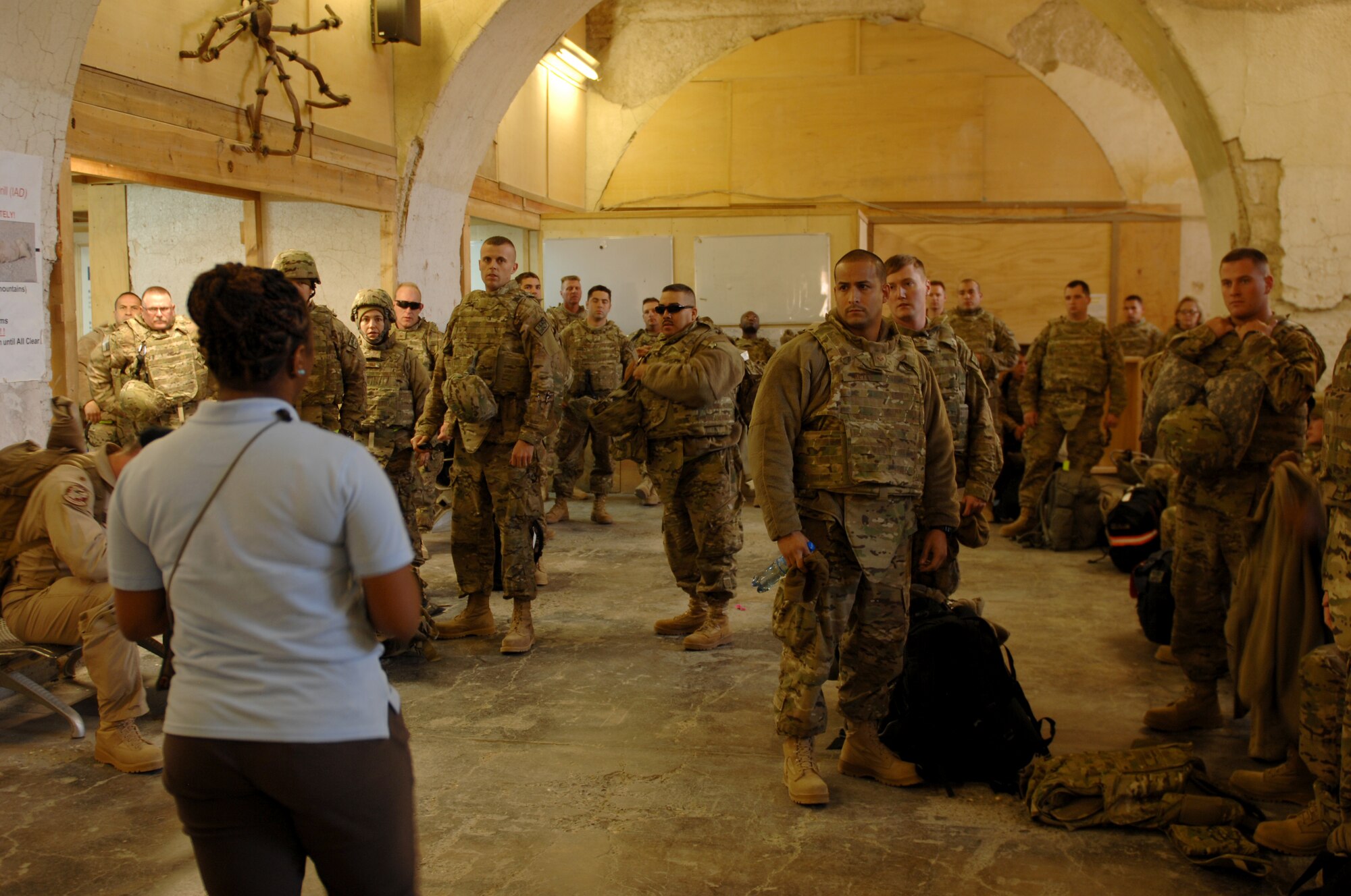 Airmen from the 457th Fighter Squadron, Carswell, Texas, receive their welcome to Kandahar Airfield, Afghanistan, brief at the inbound passenger terminal Nov. 1, 2013. The welcome briefing is one of the first steps to in processing here. (U.S. Air Force photo by Senior Airman Jack Sanders) 