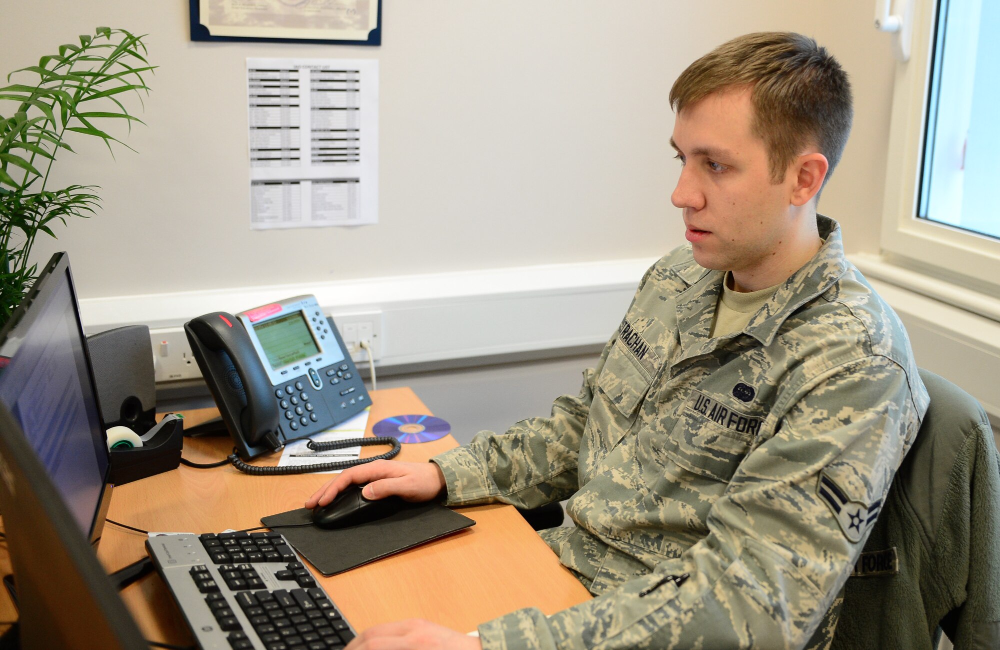 Airman 1st Class Tyler Strachan, 48th Communications Squadron client systems technician, reviews the accuracy of network cyber security software at Royal Air Force Lakenheath, England, Nov. 5, 2013. Strachan was nominated for a Liberty Spotlight because he displays the core value of ‘Excellence in All We Do.’ (U.S. Air Force photo by Airman 1st Class Dawn M. Weber/Released)