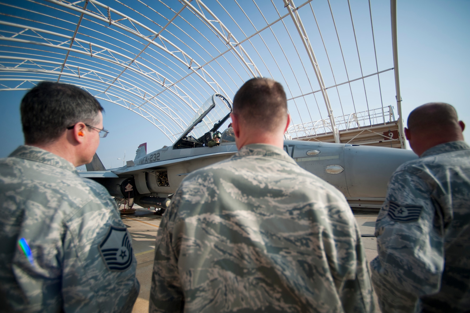 Airmen from the 8th Fighter Wing safety office spot check U.S. Marine Corps maintainers at Kunsan Air Base, Republic of Korea, Nov. 4, 2013. Wing safety staff worked side-by-side with Marine Corps counterparts to ensure not only a successful exercise, but a safe one. Max Thunder exercises foster bilateral aerial training between the Korea Air Power Team, which includes the U.S. Air Force, Marine Corps and the Republic of Korea air force. (U.S. Air Force photo by Senior Airman Armando A. Schwier-Morales/Released)