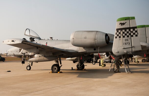 Airmen perform maintenance on an A-10 Thunderbolt prior to its participation in the Max Thunder exercise at Kunsan Air Base, Republic of Korea, Nov. 4, 2013. Max Thunder exercises foster bilateral aerial training between the Korea Air Power Team, which includes the U.S. Air Force, Marine Corps and the Republic of Korea air force. (U.S. Air Force photo by Senior Airman Armando A. Schwier-Morales/Released)