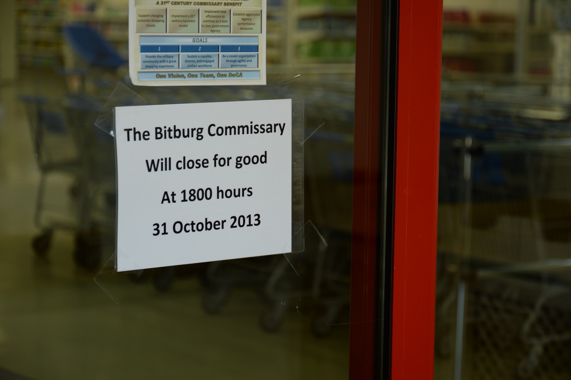 BITBURG BASE ANNEX, Germany --- A notice to customers of the Bitburg Base Annex’s Commissary pending closure remains on the store’s front door Oct. 30, 2013. The Defense Commissary Agency ceased its presence on the annex after years of continuous service since 1952. (U.S. Air Force photo by Senior Airman Joe W. McFadden / Released)