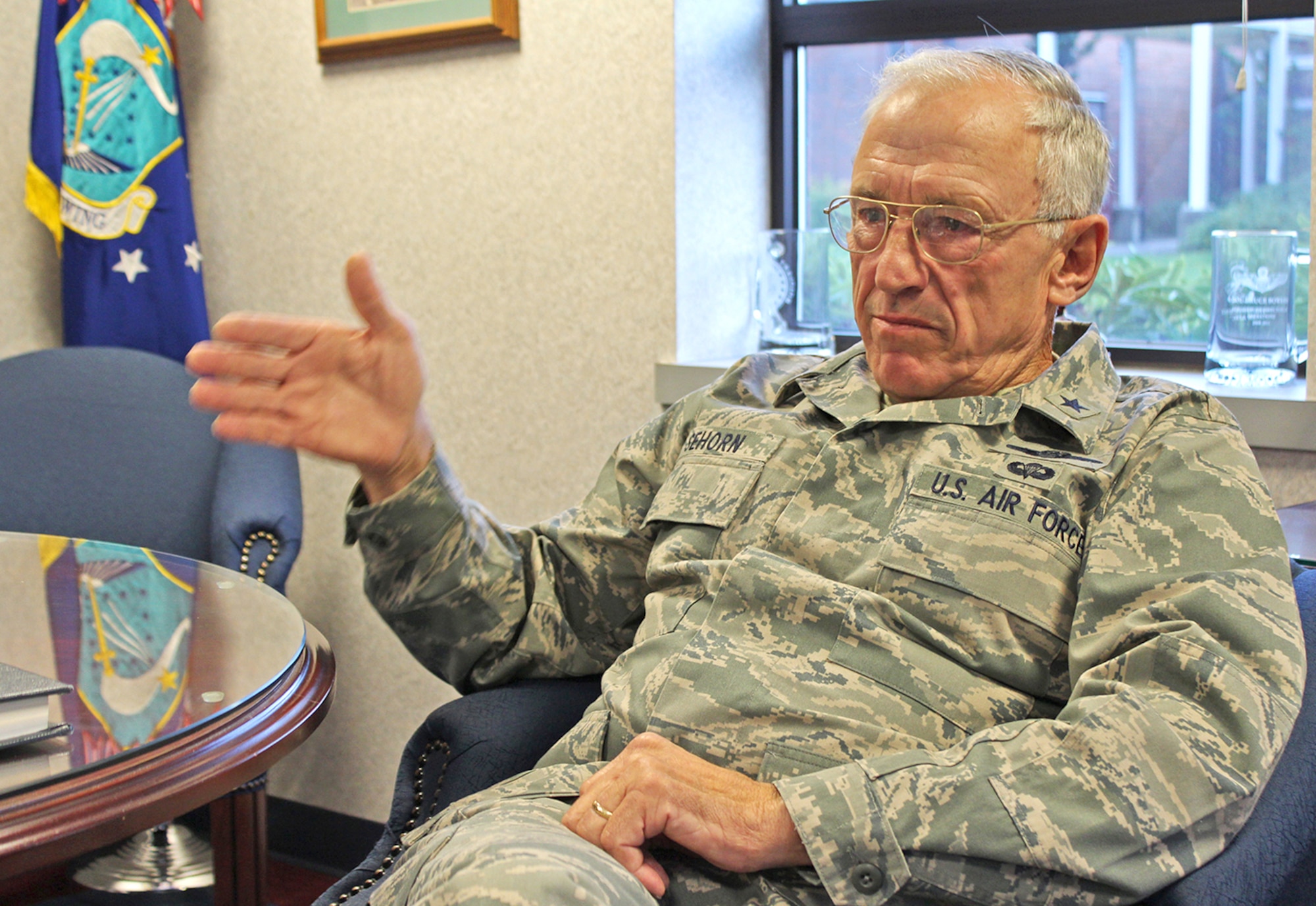 Retired Brig. Gen. James Sehorn speaks about the message he will deliver to Reservists at a wing commander's call for the 446th Airlift Wing Nov. 3 at McChord Field, Wash. Sehorn served 31 years in the Air Force, with five years and three months of that time spent as a prisoner of war in Hanoi, Vietnam, after being shot down in his F-105 "Thud" fighter jet Dec. 14, 1967. Sehorn was the commander of the 446th AW from February to December 1990. (U.S. Air Force Reserve photo by Tech. Sgt. Rachael Garneau)